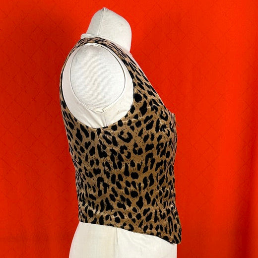 Leopard print vest over a white shirt on a red background