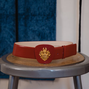 red belt with gold sigil 